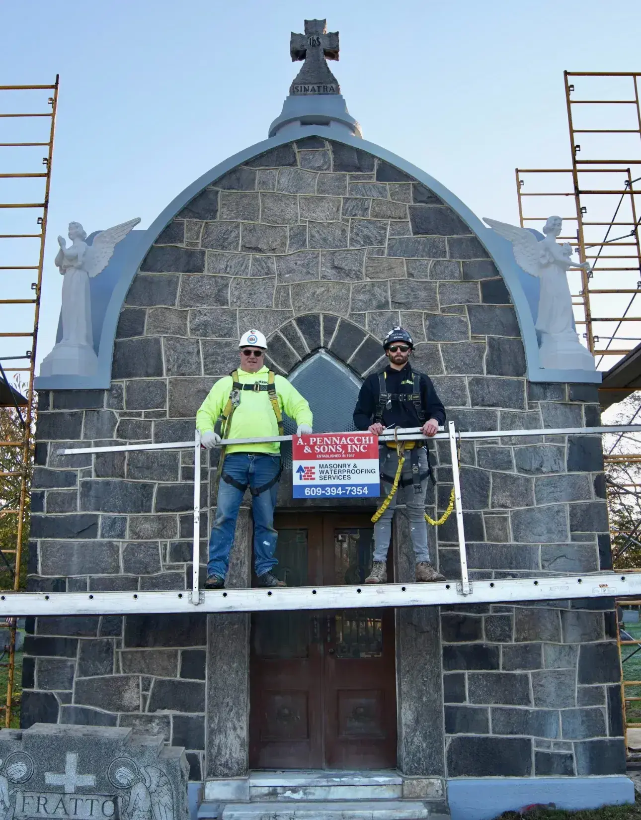 Professional masonry project execution showing expert team at work with proper safety measures